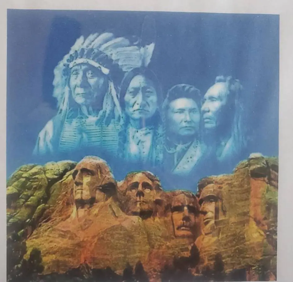 Mount Rushmore with Native American leaders depicted above.