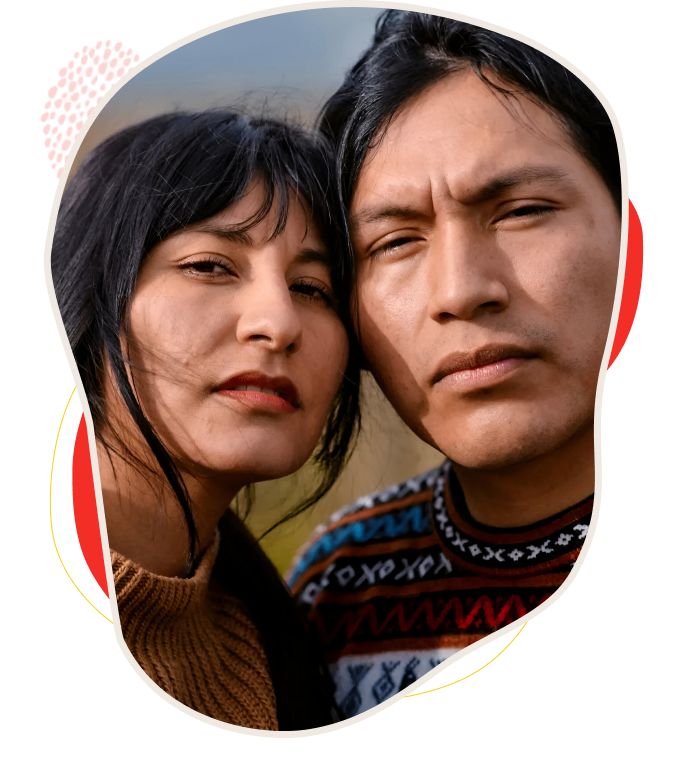 Close-up of two individuals with serious expressions outdoors.